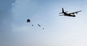 A U.S. Air Force C-130J Super Hercules cargo aircraft drops two bundles of humanitarian supplies during a humanitarian mission known as the “Chabelley Care Drop” at Chabelley Airfield, Djibouti, Feb. 21, 2026.