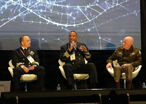 SAN ANTONIO – (March 17, 2026) – U.S. Navy Capt. Richard Gilliard Jr. (center), Medical Service Corps, commanding officer, U.S. Naval Hospital Okinawa, Japan, served as a panelist on a continuing education panel titled, “Overcoming the Unique Medical Challenges across the Indo-Pacific Theater during the 2026 Annual Operational Medicine Symposium (OpMed) & Technology Showcase held at the Henry B. Gonzales Convention Center.  Other panelists included Capt. Niels Olson, Medical Corps, chief medical officer, Human Systems Portfolio, Defense Innovation Unit; Capt. Delbert Clark, Medical Corps, command surgeon, 3rd Marine Division; U.S. Army Maj. Gen. Darrin Cox, commanding general, 18th Theater Medical Command; and Dr. Darrin Frye, chief science director, Naval Medical Research Unit San Antonio. Dr. Michael McGinnis, executive director of the U.S. Navy Bureau of Medicine and Surgery, and director of the Navy Medicine Civilian Corps served as the panel’s moderator. OpMed is one of the largest and most influential military medical events in North America for senior medical officials, clinicians, government leaders, and solution providers. The symposium explores how the Military Health System is preparing for large scale combat operations by championing innovations in combat casualty care to strengthen warfighter survivability and enhance the medical readiness of the joint force. Navy Medicine is committed to expanding partnerships in the medical field and the importance of sharing best practices, advancing medical capabilities, research and training opportunities. (U.S. Navy photo by Burrell Parmer, NAMRU San Antonio Public Affairs/Released)