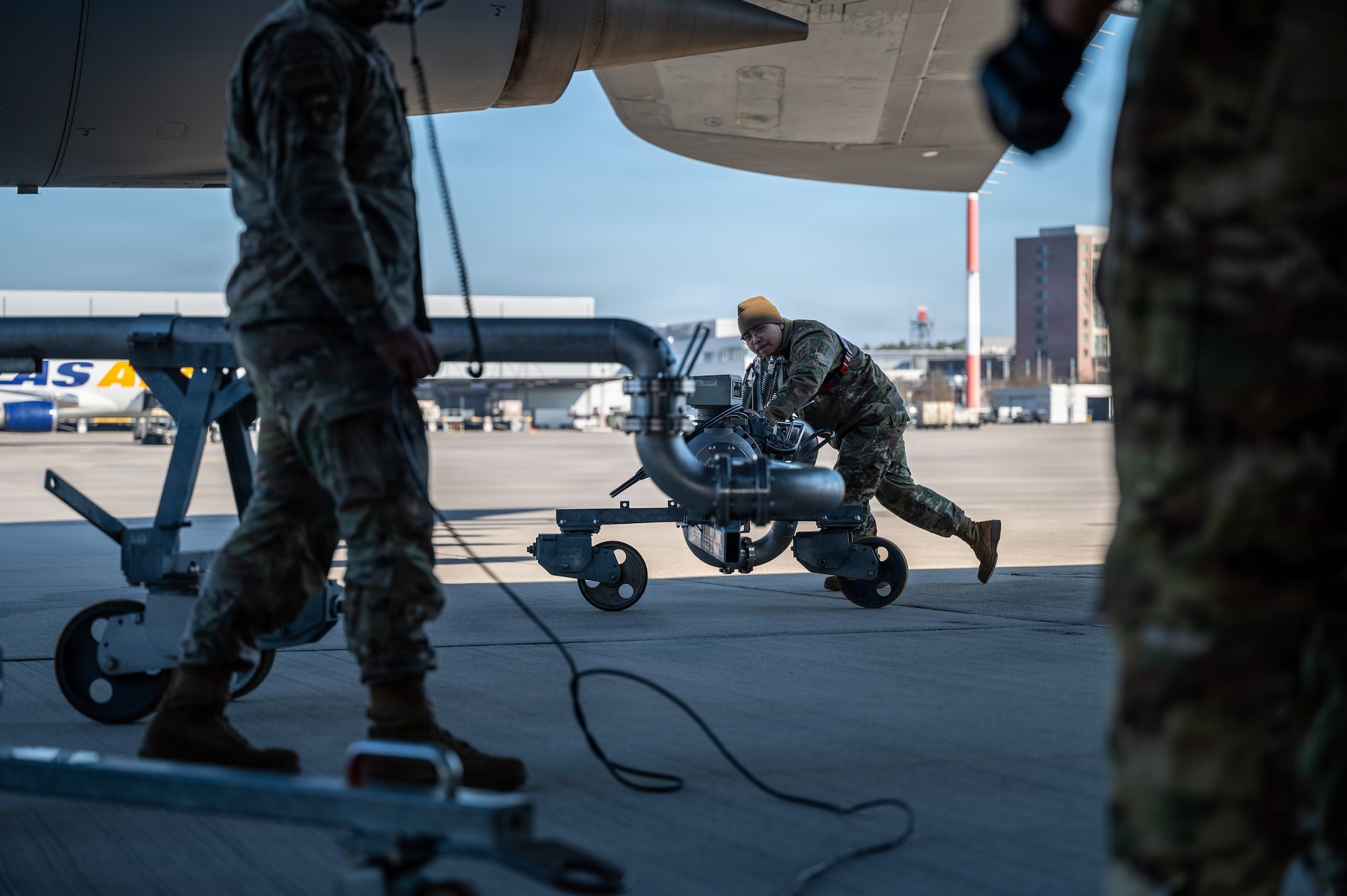 Airman 1st Class Gavan Ko, 86th Logistics Readiness Squadron fuels distributor, pushes a pantograph at Ramstein Air Base, Germany, March 4, 2026.