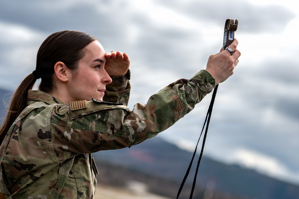 U.S. Air Force Senior Airman Mackenzie Martie, 86th Operations Support Squadron weather forecaster, uses an atmospheric sensor to measure cloud conditions at Ramstein Air Base, Germany, March 17, 2026.