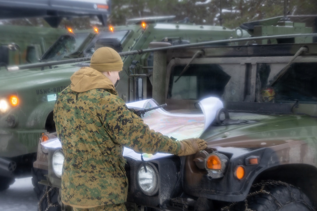 U.S. Marine Corps 2nd Lt. Daniel Charlonis, a logistics officer with Combat Logistics Battalion 6, Combat Logistics Regiment 2, 2nd Marine Logistics Group, reads a map in Rovaniemi, Finland, March 12, 2026.  Charlonis read the map during forward base camp operations as part of exercise Cold Response 26. A key component of NATO's enhanced vigilance activity Arctic Sentry, exercise Cold Response 26 is a Norwegian-led winter military exercise designed to enhance collective defense capabilities and ensure U.S. readiness to rapidly deploy and seamlessly operate alongside NATO Allies in challenging arctic conditions. Charlonis is a native of North Carolina. (U.S. Marine Corps photo by Cpl. Apollo Wilson)
