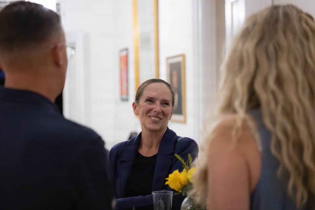 U.S. Marine Corps Lt. Gen. Roberta L. Shea, center, commanding general of Fleet Marine Force Atlantic, converses with Lt. Gen. Leonard F. Anderson IV, commander, Marine Forces Reserve and Marine Forces South and his wife, Amy Anderson, at a social event during the Sergeant Major of the Marine Corps Force Level Summit at Quarters A, New Orleans, March 9, 2026. The summit was held for senior officers and senior enlisted advisors, serving at the Marine Forces level, to discuss important and emerging topics in the Marine Corps. (U.S. Marine Corps photo by Cpl. Van Hoang)