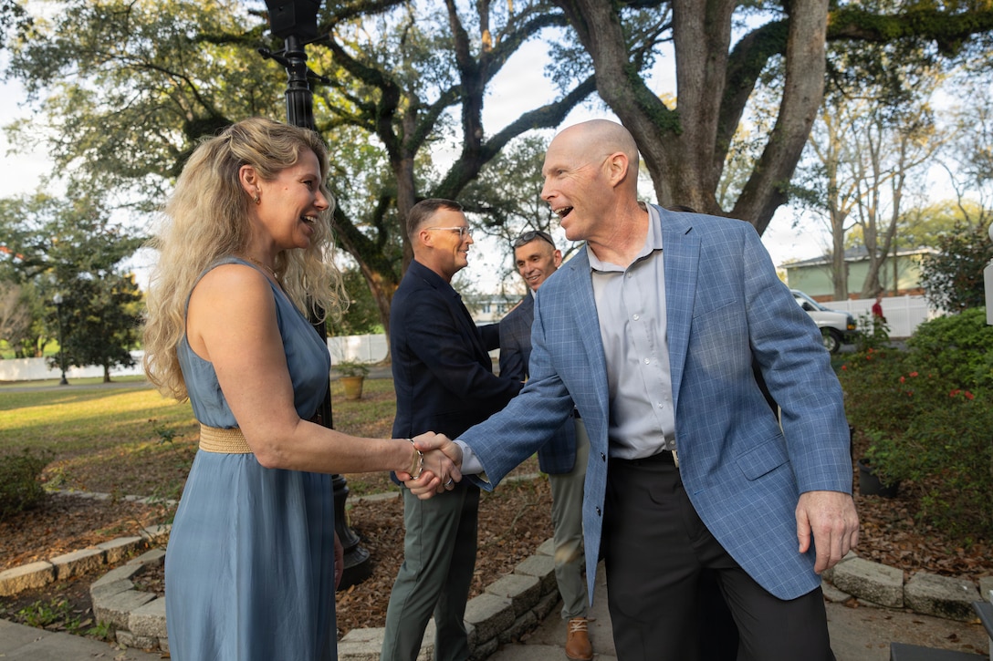 Amy Anderson, left, wife of Lt. Gen. Leonard F. Anderson IV, greets U.S. Marine Corps Sgt. Maj. Ryan A. Gnecco, senior enlisted leader of Training and Education Command, at a social event during the Sergeant Major of the Marine Corps Force Level Summit at Quarters A, New Orleans, March 9, 2026. The summit was held for senior officers and senior enlisted advisors, serving at the Marine Forces level, to discuss important and emerging topics in the Marine Corps. (U.S. Marine Corps photo by Cpl. Van Hoang)