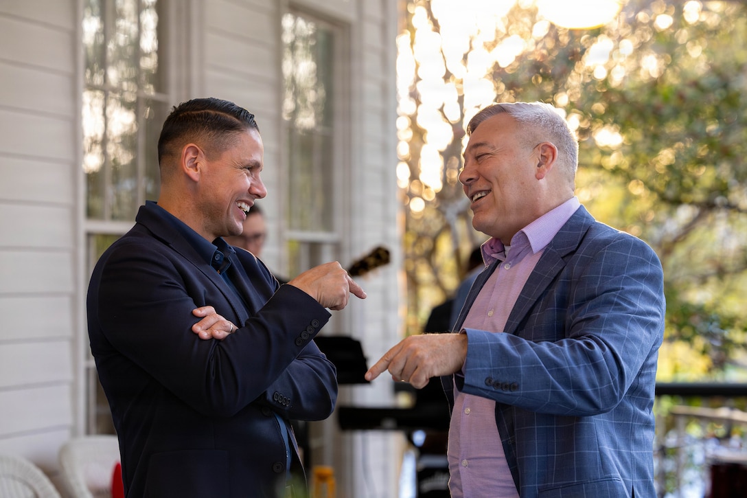 U.S. Marine Corps Sgt. Maj. Carlos A. Ruiz, the 20th Sergeant Major of the Marine Corps, left, and Gregg T. Habel, executive director of Marine Forces Reserve and Marine Forces South, converse at a social event during the Sergeant Major of the Marine Corps Force Level Summit at Quarters A, New Orleans, March 9, 2026. The summit was held for senior officers and senior enlisted advisors, serving at the Marine Forces level, to discuss important and emerging topics in the Marine Corps. (U.S. Marine Corps photo by Cpl. Van Hoang)