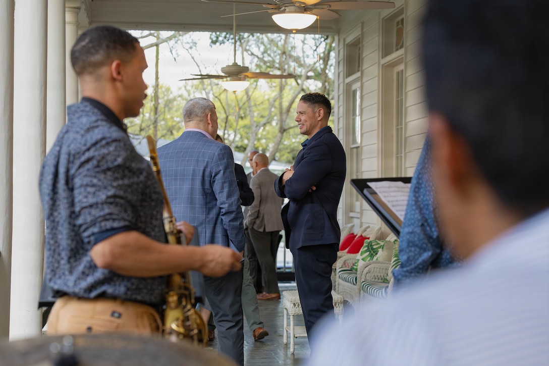 U.S. Marine Corps Sgt. Maj. Carlos A. Ruiz, the 20th Sergeant Major of the Marine Corps, right, and Gregg T. Habel, executive director of Marine Forces Reserve and Marine Forces South, discuss various topics at a social event during the Sergeant Major of the Marine Corps Force Level Summit at Quarters A, New Orleans, March 9, 2026. The summit was held for senior officers and senior enlisted advisors, serving at the Marine Forces level, to discuss important and emerging topics in the Marine Corps. (U.S. Marine Corps photo by Cpl. Van Hoang)