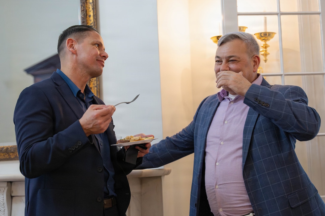 U.S. Marine Corps Sgt. Maj. Carlos A. Ruiz, the 20th Sergeant Major of the Marine Corps, left, and Gregg T. Habel, executive director of Marine Forces Reserve and Marine Forces South, talk at a social event during the Sergeant Major of the Marine Corps Force Level Summit at Quarters A, New Orleans, March 9, 2026. The summit was held for senior officers and senior enlisted advisors, serving at the Marine Forces level, to discuss important and emerging topics in the Marine Corps. (U.S. Marine Corps photo by Cpl. Van Hoang)