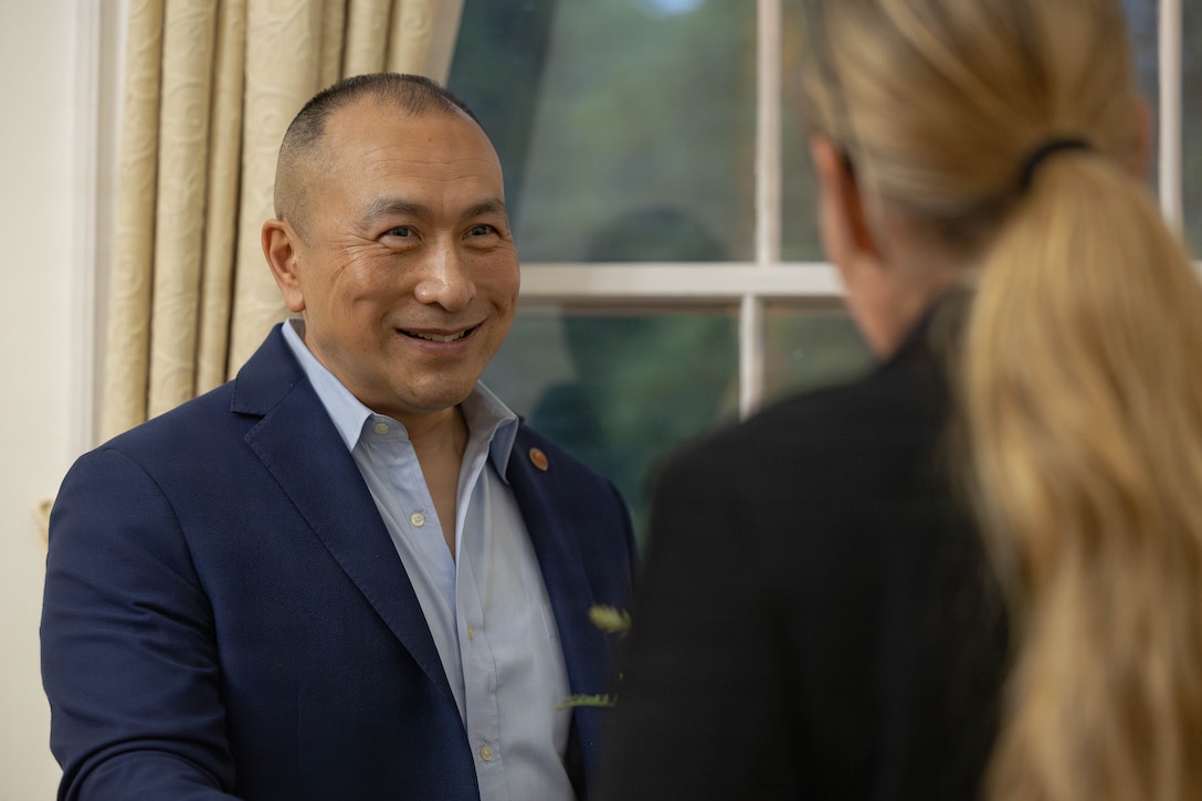 U.S. Marine Corps Sgt. Maj. Peter A. Siaw, senior enlisted leader of Marine Corps Combat Development and Integration, speaks with Sgt. Maj. Joy M. Kitashima, command senior enlisted leader of Marine Forces Pacific, at a social event during the Sergeant Major of the Marine Corps Force Level Summit at Quarters A, New Orleans, March 9, 2026. The summit was held for senior officers and senior enlisted advisors, serving at the Marine Forces level, to discuss important and emerging topics in the Marine Corps. (U.S. Marine Corps photo by Cpl. Van Hoang)