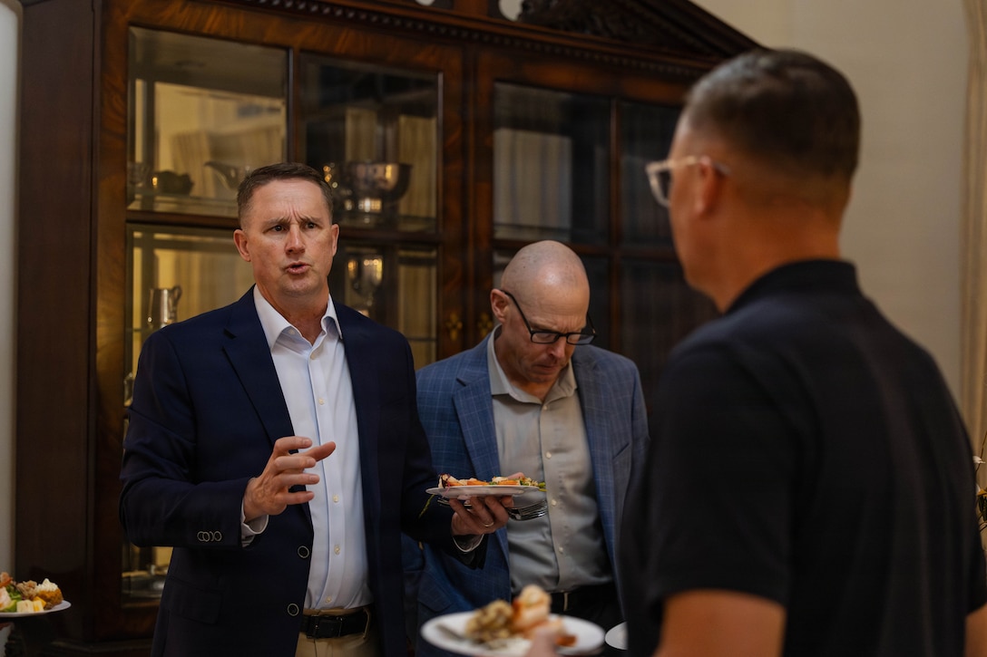 U.S. Marine Corps Maj. Gen. Douglas K. Clark, left, deputy commander, Marine Forces Reserve and Marine Forces South, converses with Lt. Gen. Leonard F. Anderson IV, commander, Marine Forces Reserve and Marine Forces South, at a social event during the Sergeant Major of the Marine Corps Force Level Summit at Quarters A, New Orleans, March 9, 2026. The summit was held for senior officers and senior enlisted advisors, serving at the Marine Forces level, to discuss important and emerging topics in the Marine Corps. (U.S. Marine Corps photo by Cpl. Van Hoang)