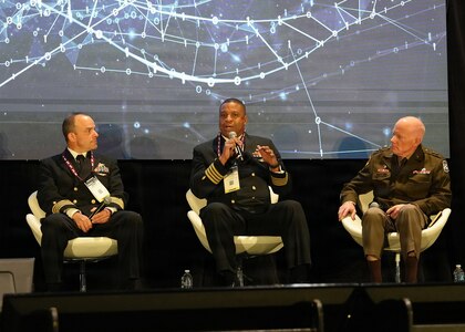 SAN ANTONIO – (March 17, 2026) – U.S. Navy Capt. Richard Gilliard Jr. (center), Medical Service Corps, commanding officer, U.S. Naval Hospital Okinawa, Japan, served as a panelist on a continuing education panel titled, “Overcoming the Unique Medical Challenges across the Indo-Pacific Theater during the 2026 Annual Operational Medicine Symposium (OpMed) & Technology Showcase held at the Henry B. Gonzales Convention Center.  Other panelists included Capt. Niels Olson, Medical Corps, chief medical officer, Human Systems Portfolio, Defense Innovation Unit; Capt. Delbert Clark, Medical Corps, command surgeon, 3rd Marine Division; U.S. Army Maj. Gen. Darrin Cox, commanding general, 18th Theater Medical Command; and Dr. Darrin Frye, chief science director, Naval Medical Research Unit San Antonio. Dr. Michael McGinnis, executive director of the U.S. Navy Bureau of Medicine and Surgery, and director of the Navy Medicine Civilian Corps served as the panel’s moderator. OpMed is one of the largest and most influential military medical events in North America for senior medical officials, clinicians, government leaders, and solution providers. The symposium explores how the Military Health System is preparing for large scale combat operations by championing innovations in combat casualty care to strengthen warfighter survivability and enhance the medical readiness of the joint force. Navy Medicine is committed to expanding partnerships in the medical field and the importance of sharing best practices, advancing medical capabilities, research and training opportunities. (U.S. Navy photo by Burrell Parmer, NAMRU San Antonio Public Affairs/Released)