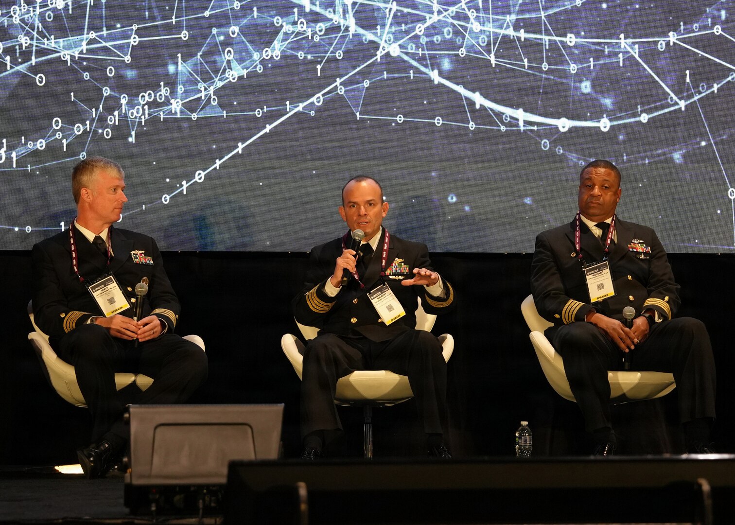 SAN ANTONIO – (March 17, 2026) – U.S. Navy Capt. Delbert Clark (center), Medical Corps, command surgeon, 3rd Marine Division, served as a panelist on a continuing education panel titled, “Overcoming the Unique Medical Challenges across the Indo-Pacific Theater during the 2026 Annual Operational Medicine Symposium (OpMed) & Technology Showcase held at the Henry B. Gonzales Convention Center.  Other panelists included Capt. Niels Olson, Medical Corps, chief medical officer, Human Systems Portfolio, Defense Innovation Unit; Capt. Richard Gilliard Jr., Medical Service Corps, commanding officer, U.S. Naval Hospital Okinawa, Japan; U.S. Army Maj. Gen. Darrin Cox, commanding general, 18th Theater Medical Command; and Dr. Darrin Frye, chief science director, Naval Medical Research Unit San Antonio. Dr. Michael McGinnis, executive director of the U.S. Navy Bureau of Medicine and Surgery, and director of the Navy Medicine Civilian Corps served as the panel’s moderator. OpMed is one of the largest and most influential military medical events in North America for senior medical officials, clinicians, government leaders, and solution providers. The symposium explores how the Military Health System is preparing for large scale combat operations by championing innovations in combat casualty care to strengthen warfighter survivability and enhance the medical readiness of the joint force. Navy Medicine is committed to expanding partnerships in the medical field and the importance of sharing best practices, advancing medical capabilities, research and training opportunities. (U.S. Navy photo by Burrell Parmer, NAMRU San Antonio Public Affairs/Released)