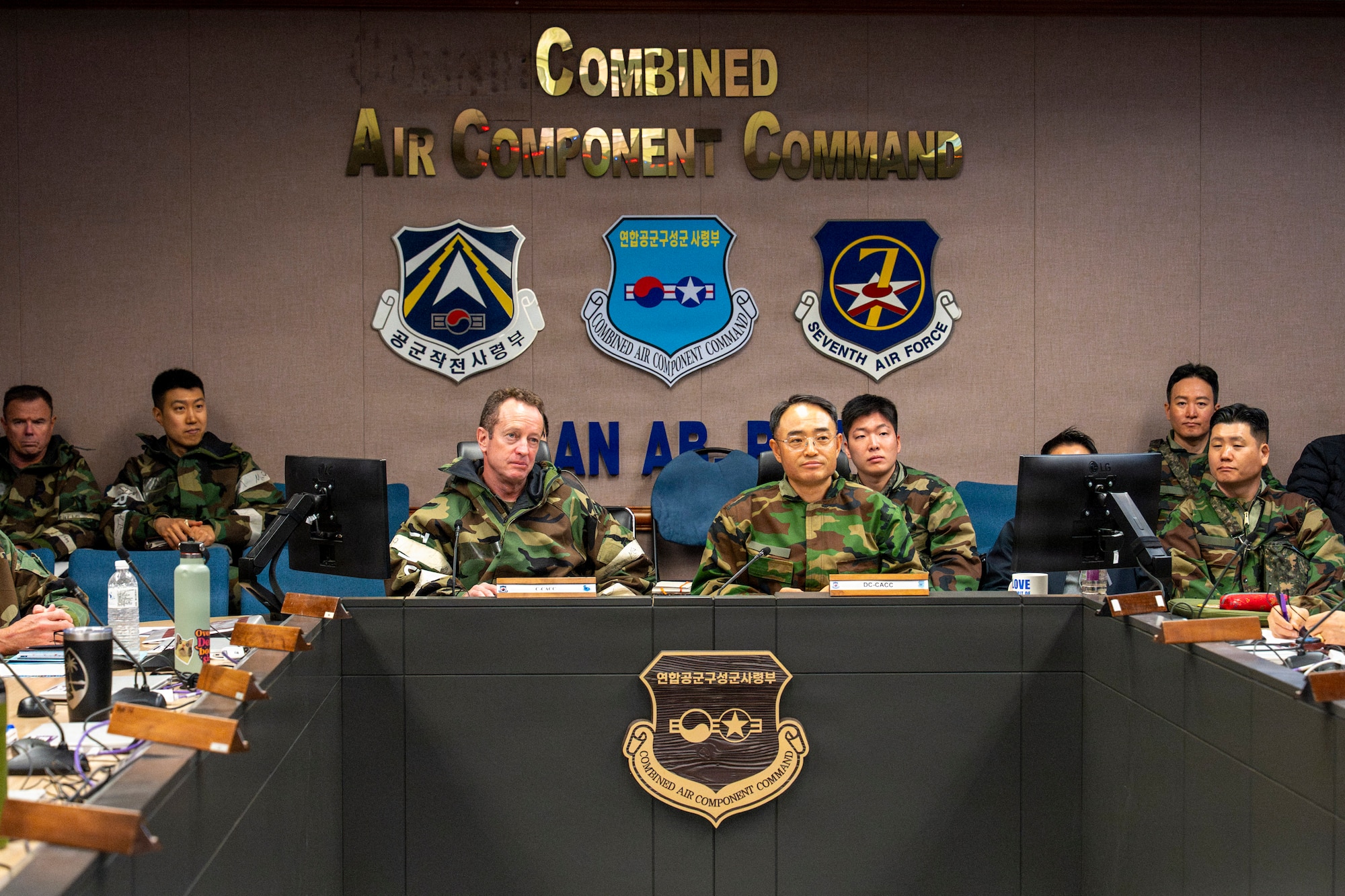 U.S. Air Force Lt. Gen. David Iverson, center left, Seventh Air Force and Combined Air Component Command commander, and South Korea air force Lt. Gen. Jun Sun Cha, center right, South Korea Air Force Operations Command and CACC deputy commander, host a meeting during exercise Freedom Shield 26 at Osan Air Base, South Korea, March 13, 2026. The CACC integrates U.S. and South Korea airpower to plan, direct and execute combined air operations across the Korean Peninsula. (U.S. Air Force photo by Senior Airman Brenden Beezley)