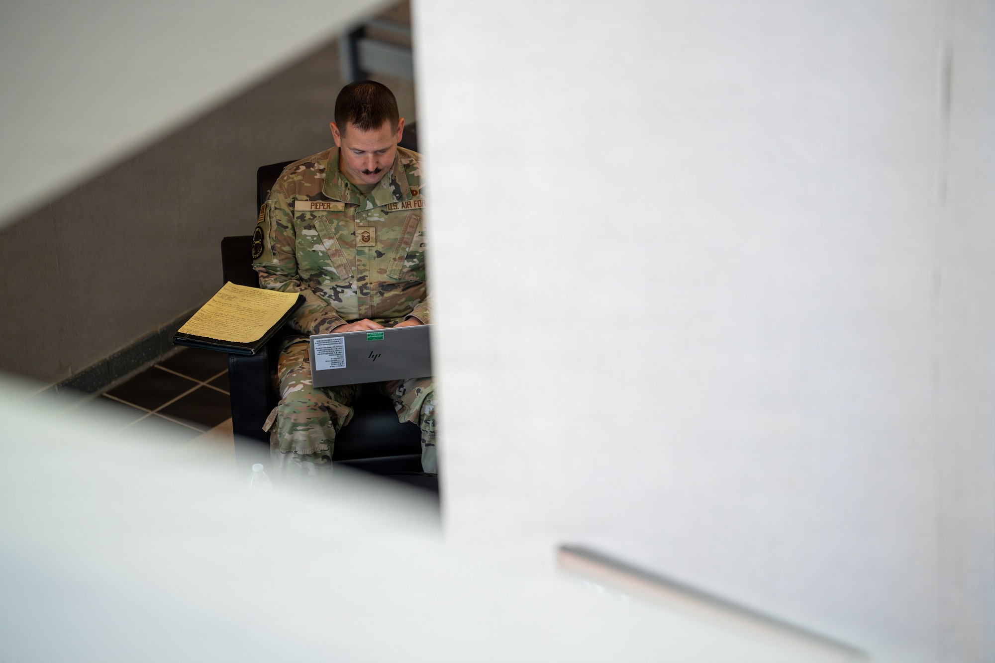 U.S. Air Force Master Sgt. Anthony Pieper, a student attending the U.S. Air Force Senior Noncommissioned Officer Academy, reviews course material during the Airmanship 800 program at Maxwell Air Force Base’s Gunter Annex. The academy emphasizes analytical discipline and decision-making to help senior enlisted leaders identify risk early and support operational execution. (U.S. Air Force photo by Billy Blankenship)