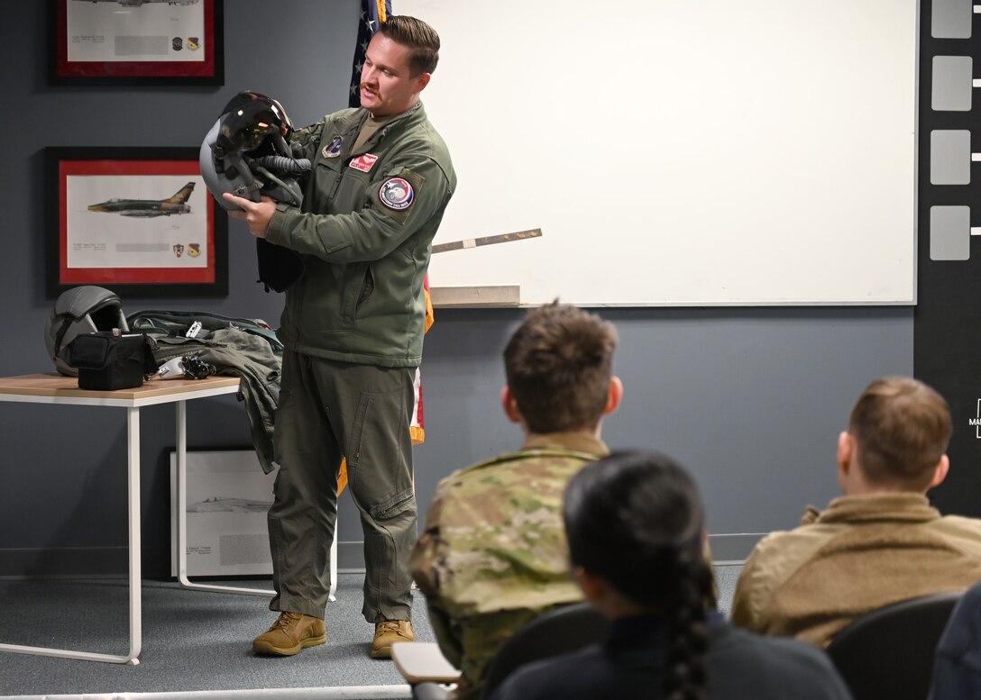 1st LT. Eric Flynn, 104th Fighter Wing pilot, speaks to 40 cadets from various AFROTC colleges, April 10, 2025, Barnes Air National Guard Base, Westfield, MA, April 9, 2025. Yale, University of New Hampshire, Boston University, University of Umass, and Worcester Polytechnic Institute toured the 104th Fighter Wing to learn more about its missions and to speak to other officers in their interested career fields. (U.S. Air National Guard Photo by Melanie J. Casineau)