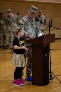 Lt. Col. (P) Bradley Roach, incoming commander of the 34th Infantry Division Sustainment Brigade (IDSB), delivers remarks during the change of command ceremony