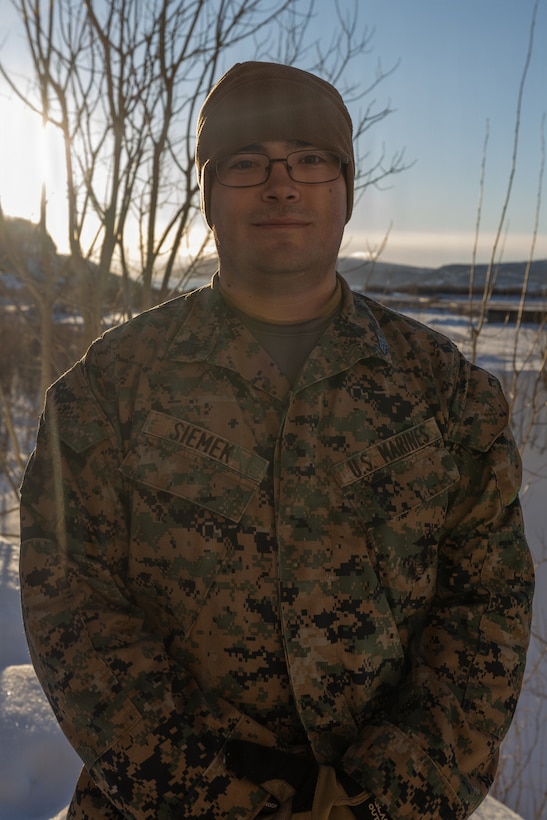 U.S. Marine Corps Sgt. Tristan Siemek, a military policeman with 4th Law Enforcement Battalion, Force Headquarters Group, poses for a photo during exercise Cold Response 26 in Elvegardsmoen, Norway, Mar. 2, 2026. A key component of NATO's enhanced vigilance activity Arctic Sentry, exercise Cold Response 26 is a Norwegian-led winter military exercise designed to enhance collective defense capabilities and ensure U.S. readiness to rapidly deploy and seamlessly operate alongside NATO Allies in challenging arctic conditions. Siemek is a native of Colorado. (U.S. Marine Corps photo by Sgt. Emily De La Torre)