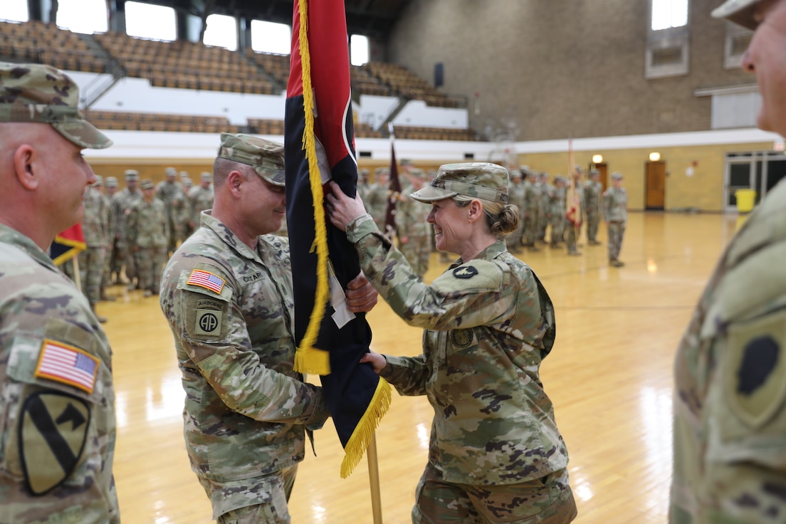 Col. Elizabeth Roxworthy receives the Brigade’s flag from Command Sgt. Maj. Joseph Cistaro during a change of command ceremony