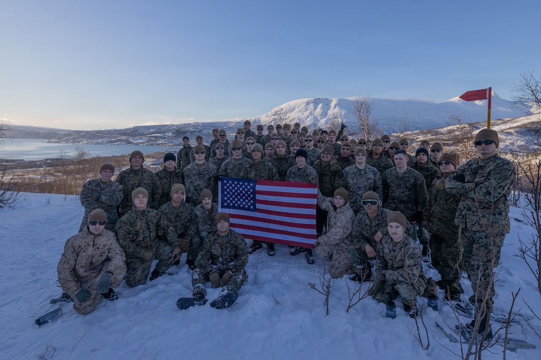 U.S. Marines with 4th Law Enforcement Battalion, Force Headquarters Group, pose for a photo after a hike during exercise Cold Response 26 in Elvegardsmoen, Norway, Mar. 2, 2026.  A key component of NATO's enhanced vigilance activity Arctic Sentry, exercise Cold Response 26 is a Norwegian-led winter military exercise designed to enhance collective defense capabilities and ensure U.S. readiness to rapidly deploy and seamlessly operate alongside NATO Allies in challenging arctic conditions. (U.S. Marine Corps photo by Sgt. Emily De La Torre)