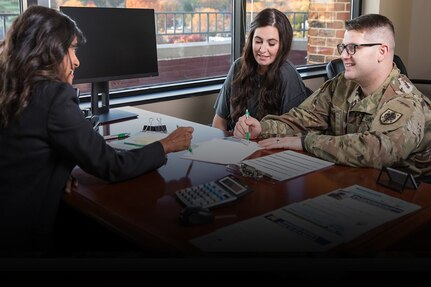 Soldier and spouse speak with a personal financial counselor