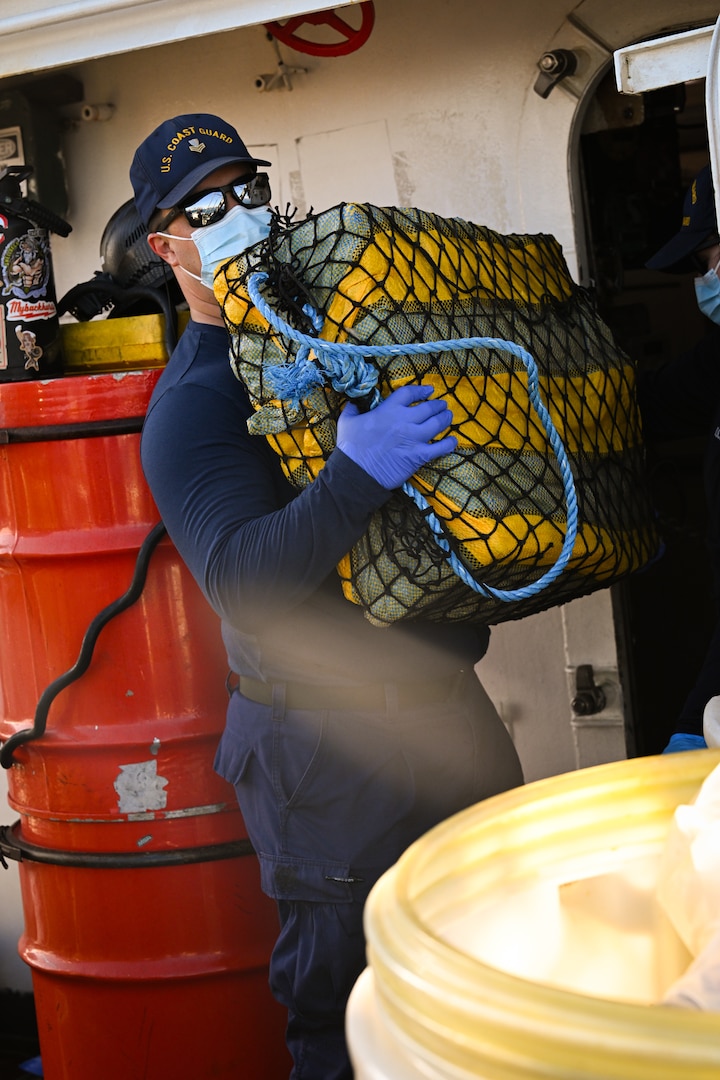 Crewmembers from Coast Guard Cutter Forward (WMEC-911) offload illicit narcotics in Port Everglades, Florida, March 19, 2026. The offload contained an estimated $49.3 million in cocaine the Coast Guard and its partners intercepted in the international waters of the Eastern Pacific Ocean. (U.S. Coast Guard photo by Seaman Christopher Moret)