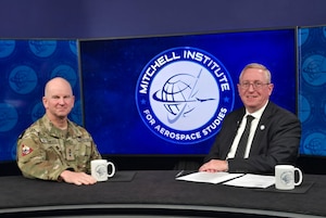 Lt. Gen. Dennis Bythewood, commander of U.S. Space Forces – Space (S4S) and the Combined Joint Force Space Component Commander, left, poses with Charles Galbreath, Director and Senior Resident Fellow for Spacepower Studies, The Mitchell Institute Spacepower Advantage Center of Excellence during an interview at the Mitchell Institute for Aerospace Studies as part of its Schriever Spacepower Series in Arlington, Va., March 13, 2026.