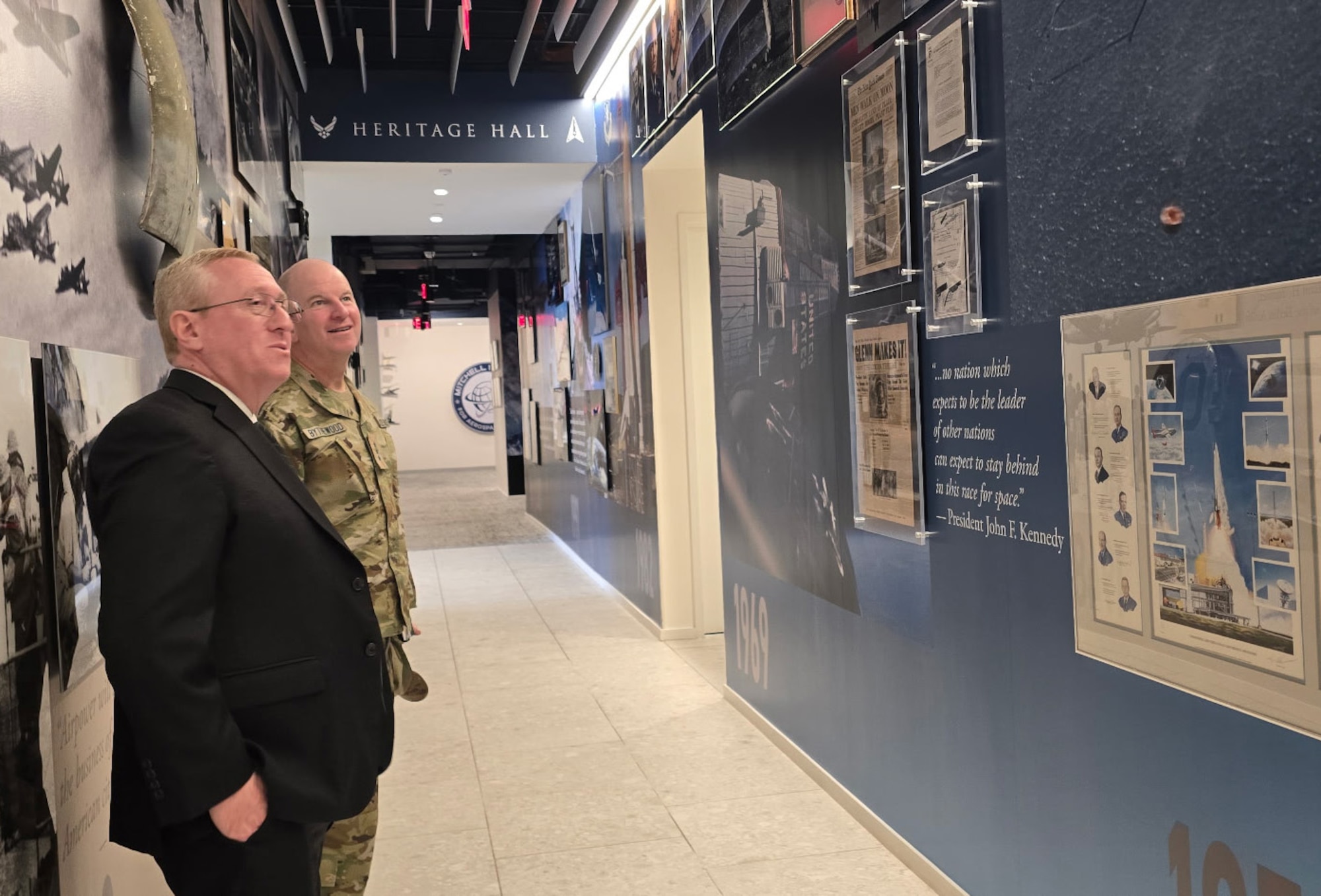 Two men review photographs