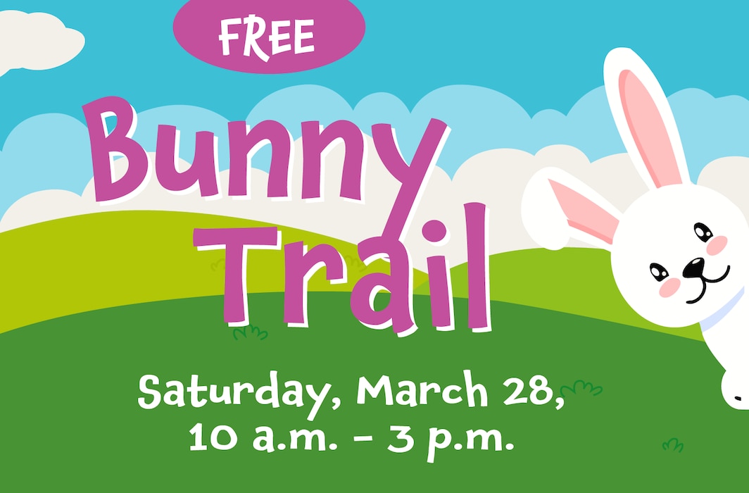 cute comic bunny peeking in from the right over a field of green and sky of blue and white clouds. Text reads FREE, Bunny Trail Saturday March 28, 10 a.m. - 3 p.m.