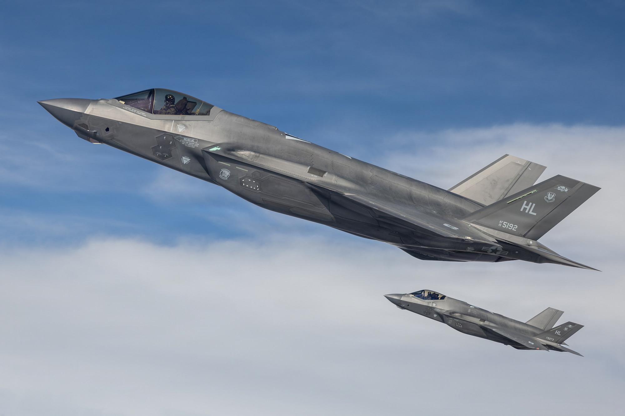 A photo of two F-35s in flight