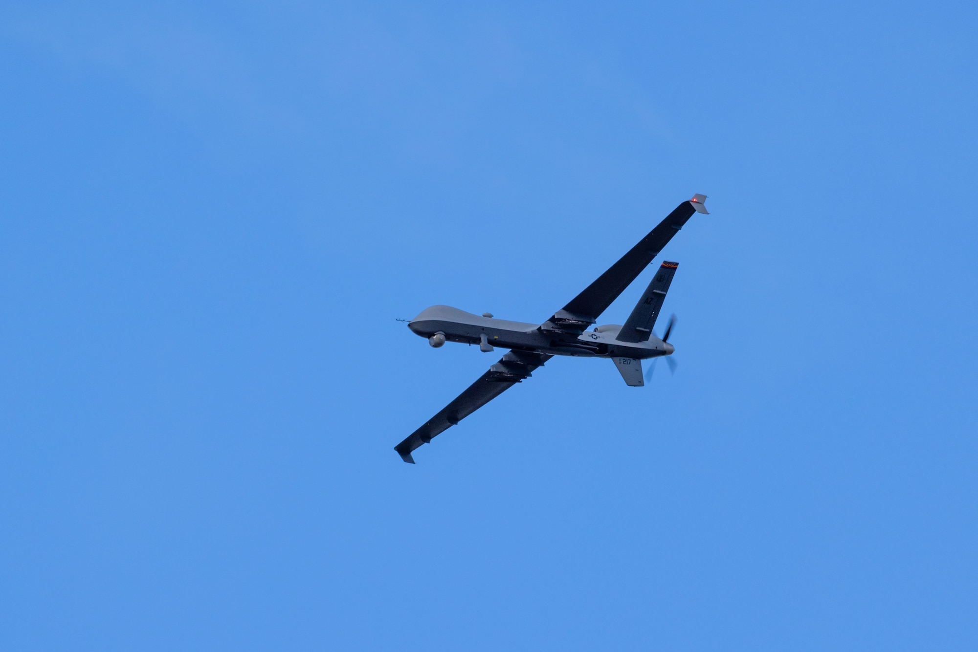 A U.S. Air National Guard MQ-9 Reaper unmanned aircraft system with the 214th Attack Group, flies above Davis-Monthan Air Force Base, Ariz., Mar. 10, 2026. By building expertise in agile, decentralized operations, the 214th enhances the lethality and adaptability of the entire force, ensuring the Arizona Air National Guard is prepared to meet national defense objectives. (U.S. Air National photo by Tech. Sgt. Stephen Luke)