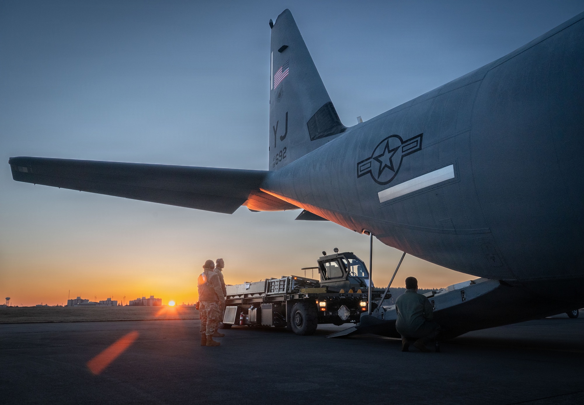 U.S. Air Force Airmen assigned to the 374th Airlift Wing load a K-loader onto a C-130J Super Hercules assigned to the 36th Airlift Squadron during exercise Beverly Midnight 2026 at Yokota Air Base, Japan, March 11, 2026.