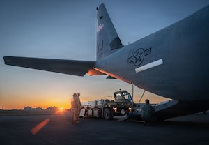 U.S. Air Force Airmen assigned to the 374th Airlift Wing load a K-loader onto a C-130J Super Hercules assigned to the 36th Airlift Squadron during exercise Beverly Midnight 2026 at Yokota Air Base, Japan, March 11, 2026.