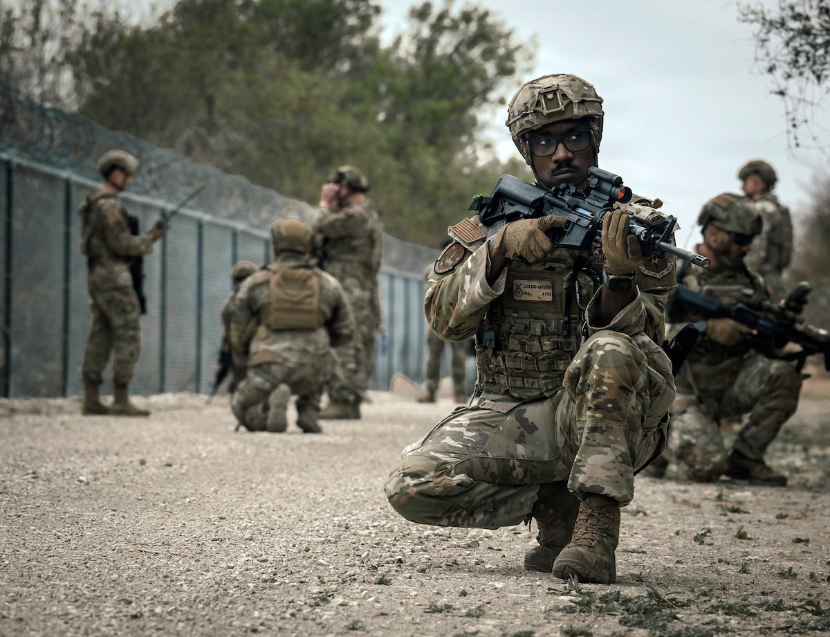 Senior Airman Latreon Jackson, 47th Security Forces Squadron armory operations lead, takes a defensive position during a simulated base defense scenario at Laughlin Air Force Base, Texas, March 3, 2026. The training focused on recapturing a strategic location from opposing forces and establishing defensive control. (U.S. Air Force photo by Airman 1st Class Harrison Sullivan)