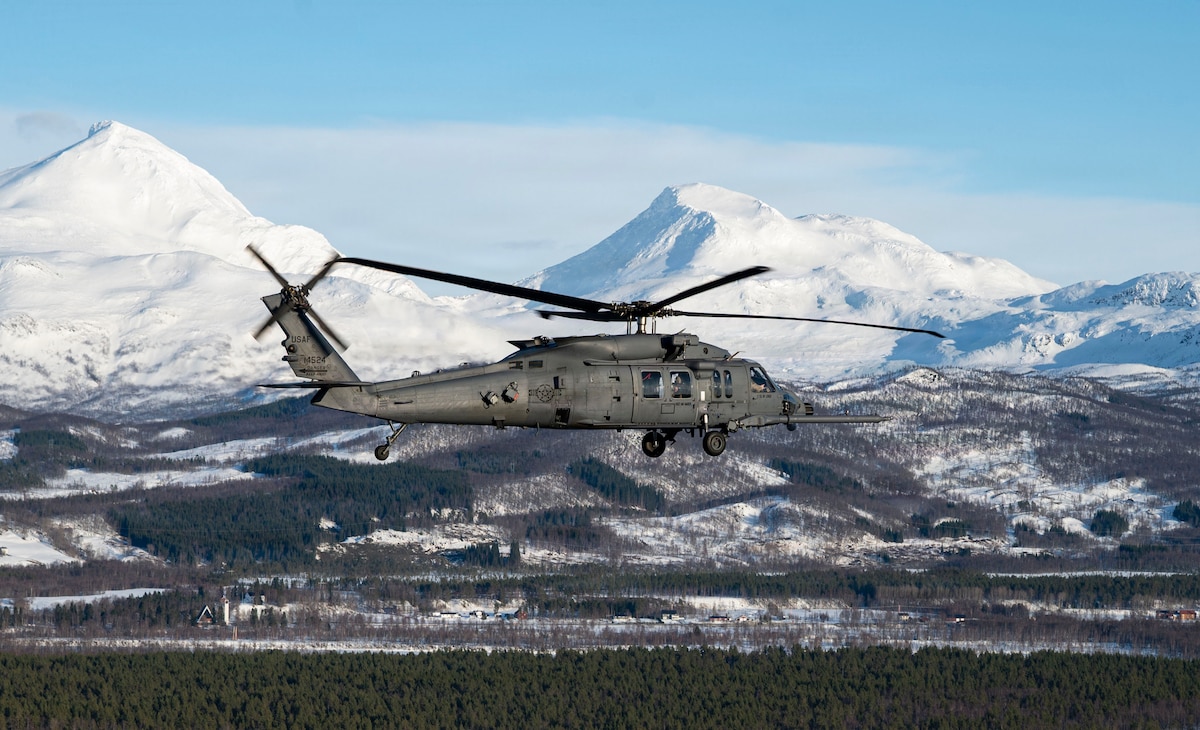 A U.S. Air Force HH-60W Jolly Green II carries Airmen assigned to the 56th Rescue Squadron and Swedish Air Force rangers during exercise Cold Response 26 at Bardufoss Air Station, Norway, March 12, 2026. Integrated exercises like Cold Response strengthen rapid response capability and Arctic sustainment while reinforcing NATO collective defense. (U.S. Air Force photo by Staff Sgt. Brooke Rogers)