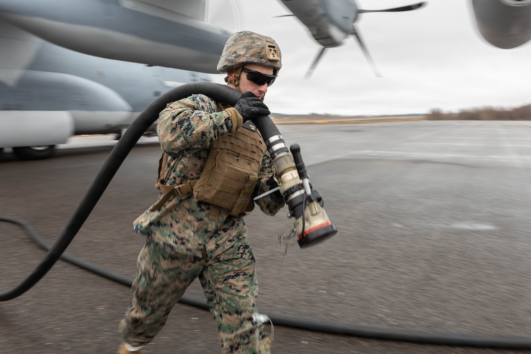 U.S. Marine Corps Lance Cpl. Scott Bolduc, an expeditionary fuels technician with Marine Wing Support Squadron (MWSS) 273, Marine Air Control Group 28, 2nd Marine Aircraft Wing, detaches a fuel hose to a KC-130J Super Hercules aircraft with Marine Aerial Refueler Transport Squadron (VMGR) 252, Marine Aircraft Group 14, 2nd Marine Aircraft Wing at Rygge Air Base, Norway, March 17, 2026. MWSS-273 refueled VMGR-252 KC-130J aircraft at a forward arming and refueling point to support flight operations during exercise Cold Response 26. A key component of NATO's enhanced vigilance activity Arctic Sentry, exercise Cold Response 26 is a Norwegian-led winter military exercise designed to enhance collective defense capabilities and ensure U.S. readiness to rapidly deploy and seamlessly operate alongside NATO Allies in challenging arctic conditions. (U.S. Marine Corps photo by Cpl. Mya Seymour)