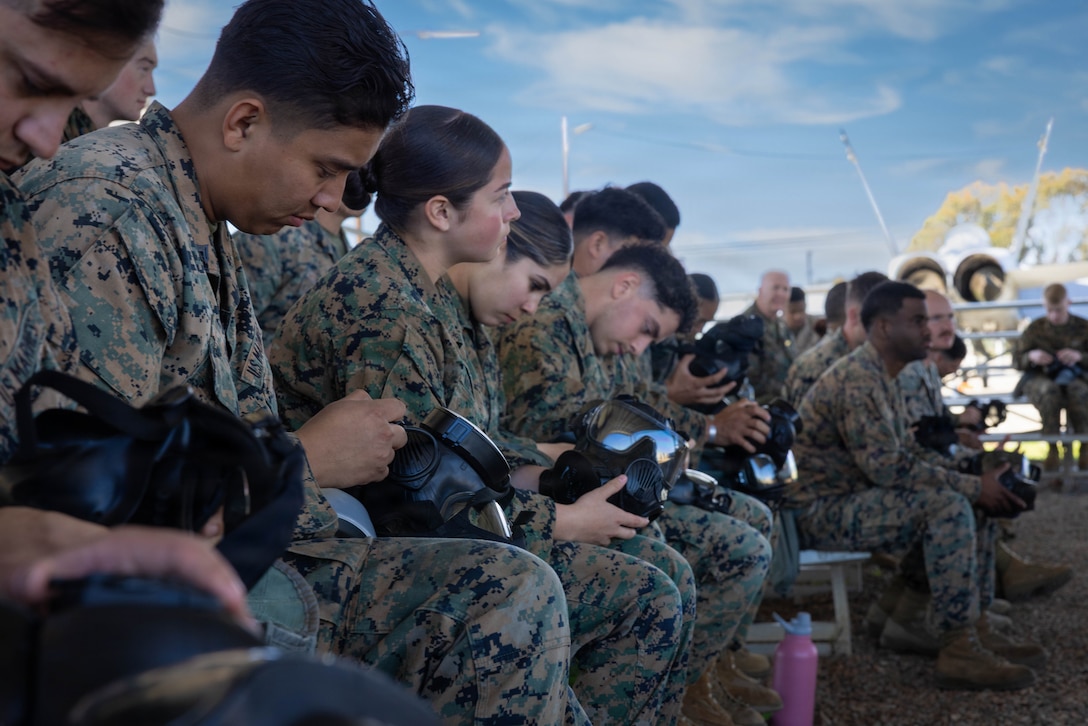 U.S. Marines and Sailors with 4th Medical Battalion, 4th Marine Logistics Group, Marine Forces Reserve, sit and partake in a chemical, biological, radiological and nuclear class before entering a gas chamber during a Reserve Mobilization Exercise, East Miramar, California, March 3, 2026. The week-long exercise validates the battalion’s ability to rapidly activate personnel and equipment, ensuring the unit can deliver ready forces in response to a national crisis. (U.S. Marine Corps photo by Lance Cpl. Claire Cheney)