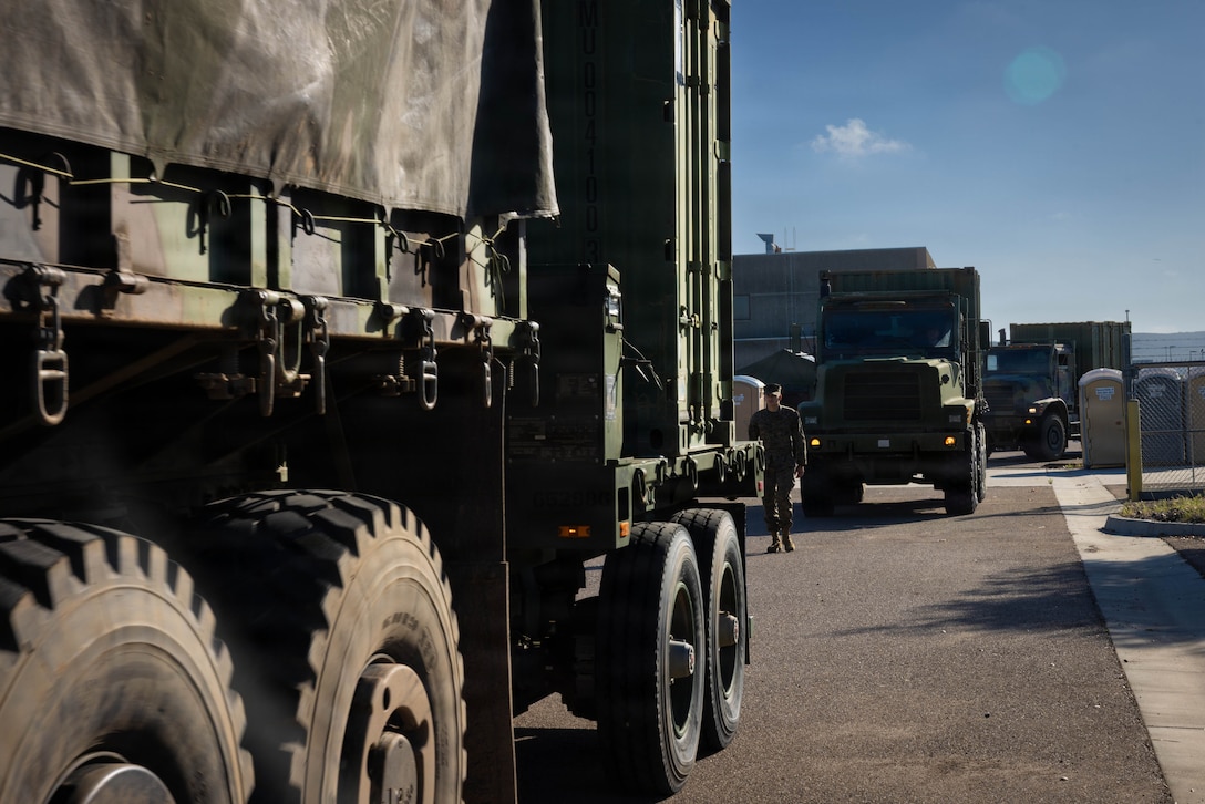 U.S. Marines with 4th Medical Battalion, 4th Marine Logistics Group, Marine Forces Reserve, line up Medium Tactical Vehicle Replacement to prepare them for mobilization during a Reserve Mobilization Exercise, San Diego, California, March 3, 2026. The week-long exercise validates the battalion’s ability to rapidly activate personnel and equipment, ensuring the unit can deliver ready forces in response to a national crisis. (U.S. Marine Corps photo by Lance Cpl. Claire Cheney)