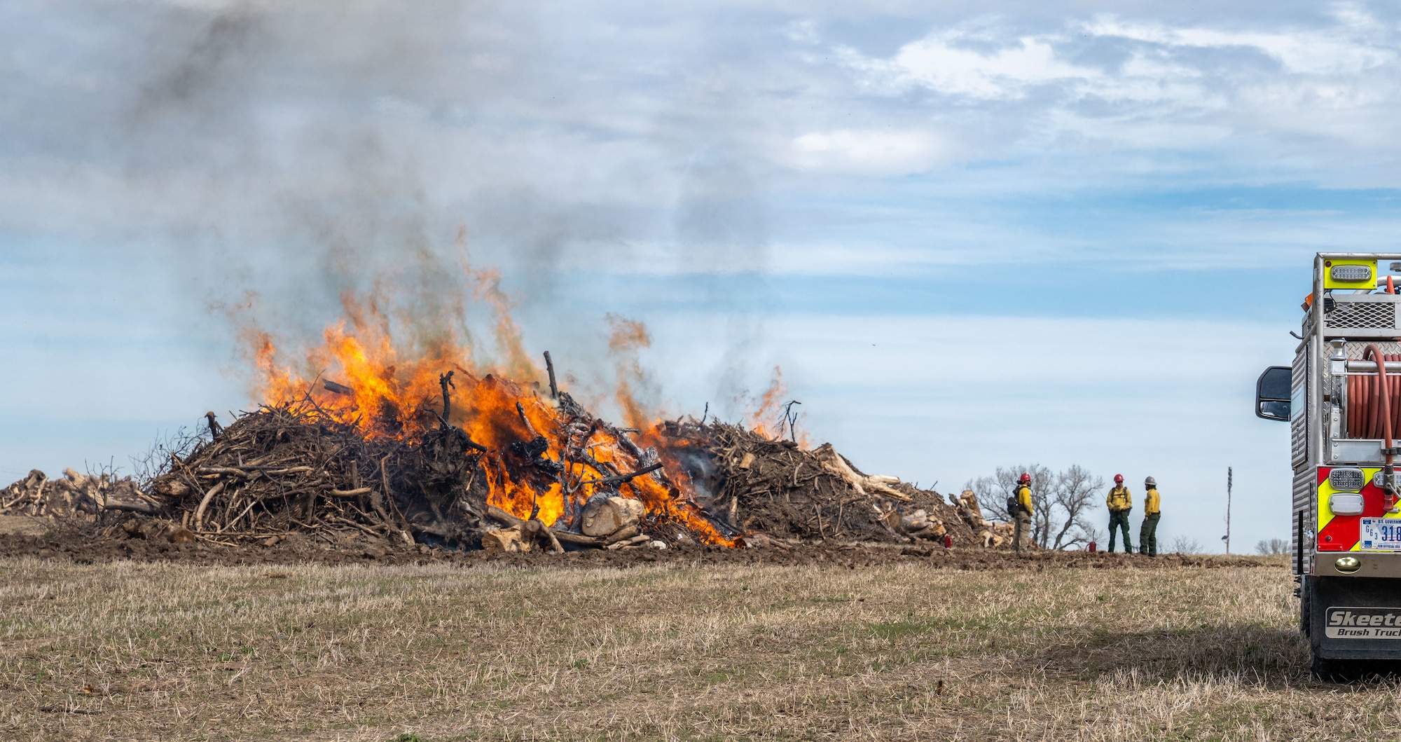 Fire personnel conduct a controlled burn at McConnell Air Force Base, Kansas, March 18, 2026. Controlled burns are performed to reduce wildfire risk and maintain the base’s ecosystem. (U.S. Air Force photo by Senior Airman Paula Arce)