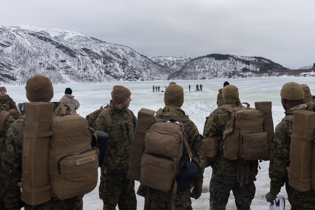U.S. Marines with 4th Law Enforcement Battalion, Force Headquarters Group, participate in cold-weather survival training in Elvegardsmoen, Norway, March 10, 2026. The cold plunge is a part of the cold-weather training conducted by NATO partners and allies in preparation for exercise Cold Response 26. A key component of NATO's enhanced vigilance activity Arctic Sentry, exercise Cold Response 26 is a Norwegian-led winter military exercise designed to enhance collective defense capabilities and ensure U.S. readiness to rapidly deploy and seamlessly operate alongside NATO Allies in challenging arctic conditions. (U.S. Marine Corps photo by Sgt. Emily De La Torre)