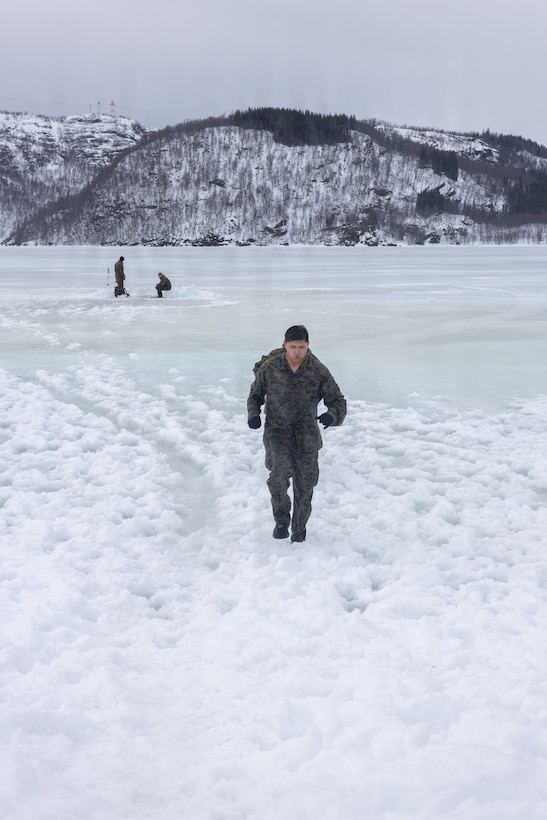 U.S. Marine Corps Cpl. Sheldon Coolie, a military police officer with 4th Law Enforcement Battalion, Force Headquarters Group, participates in cold-weather survival training in Elvegardsmoen, Norway, March 10, 2026. The cold plunge is a part of the cold-weather training conducted by NATO partners and allies in preparation for exercise Cold Response 26. A key component of NATO's enhanced vigilance activity Arctic Sentry, exercise Cold Response 26 is a Norwegian-led winter military exercise designed to enhance collective defense capabilities and ensure U.S. readiness to rapidly deploy and seamlessly operate alongside NATO Allies in challenging arctic conditions. Coolie is a native of New Mexico. (U.S. Marine Corps photo by Sgt. Emily De La Torre)