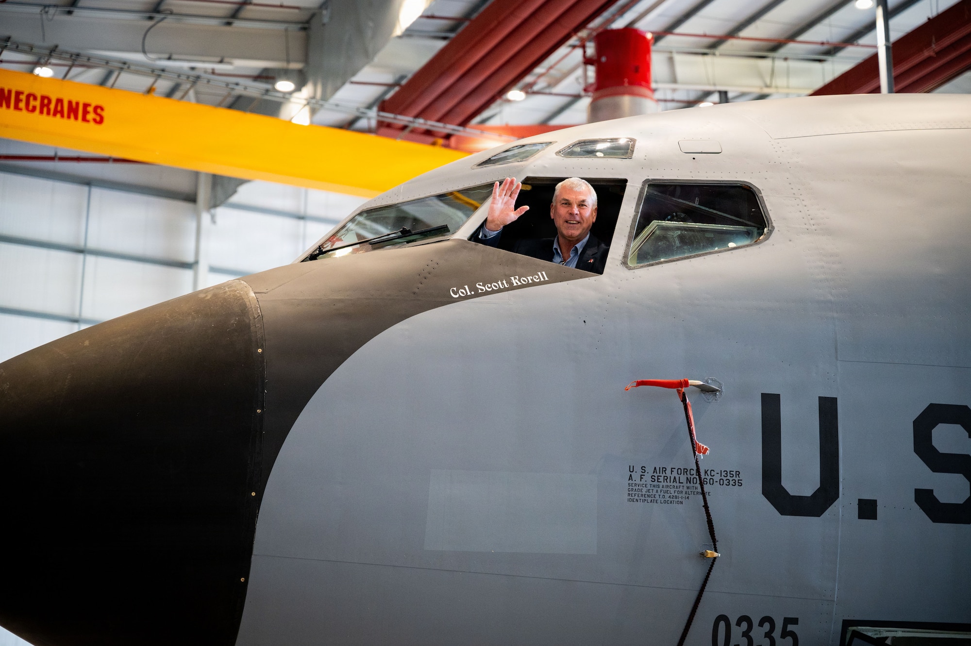 Mr. David Collinson, Lion Squadron, waves out of the window of the RAF Mildenhall KC-135 Stratotanker after the Honorary Commanders Induction Ceremony at RAF Mildenhall, England, March 19, 2026.