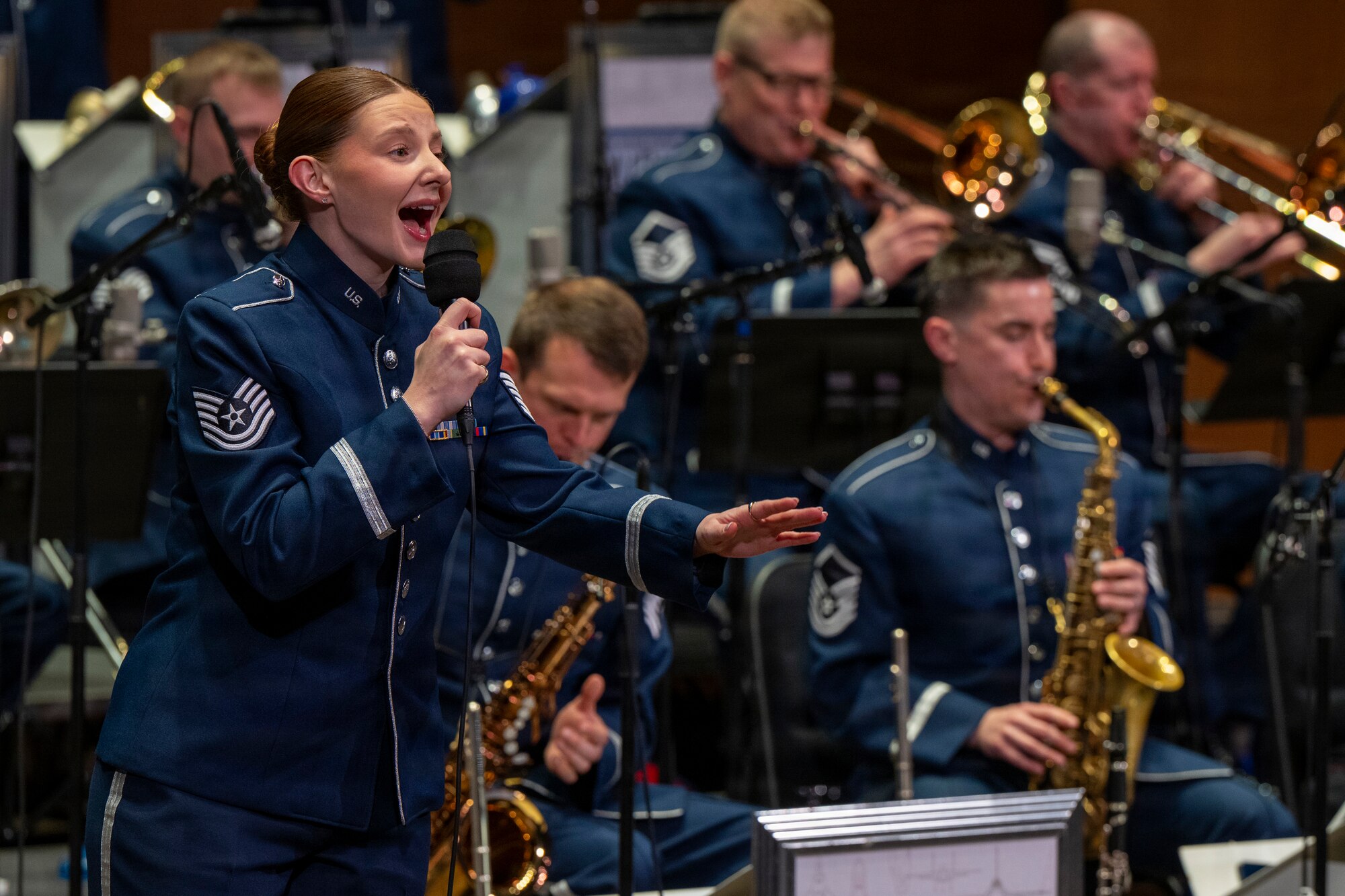 U.S. Air Force Tech. Sgt. Clara Campbell, the vocalist with the U.S. Air Force Band’s Airmen of Note, performs during a Jazz Heritage Series concert in Alexandria, Va., March 12, 2026. The “Note” showcased excellence in music to match the efforts of Airmen stationed worldwide, whose selfless service and sacrifices have ensured the freedoms enjoyed by citizens of the United States. (U.S. Air Force photo by Hayden Hallman)