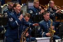 U.S. Air Force Tech. Sgt. Clara Campbell, the vocalist with the U.S. Air Force Band’s Airmen of Note, performs during a Jazz Heritage Series concert in Alexandria, Va., March 12, 2026. The “Note” showcased excellence in music to match the efforts of Airmen stationed worldwide, whose selfless service and sacrifices have ensured the freedoms enjoyed by citizens of the United States. (U.S. Air Force photo by Hayden Hallman)