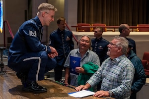 U.S. Air Force Tech. Sgt. Seth Ebersole, the baritone saxophonist with The U.S. Air Force Band’s Airmen of Note, meets with audience members after a Jazz Heritage Series concert in Alexandria, Va., March 12, 2026. In 1990, the Airmen of Note established the Jazz Heritage Series, featuring the Air Force ensemble in concert with legendary icons of jazz to highlight America’s jazz legacy and connect with the community. (U.S. Air Force photo by Hayden Hallman)