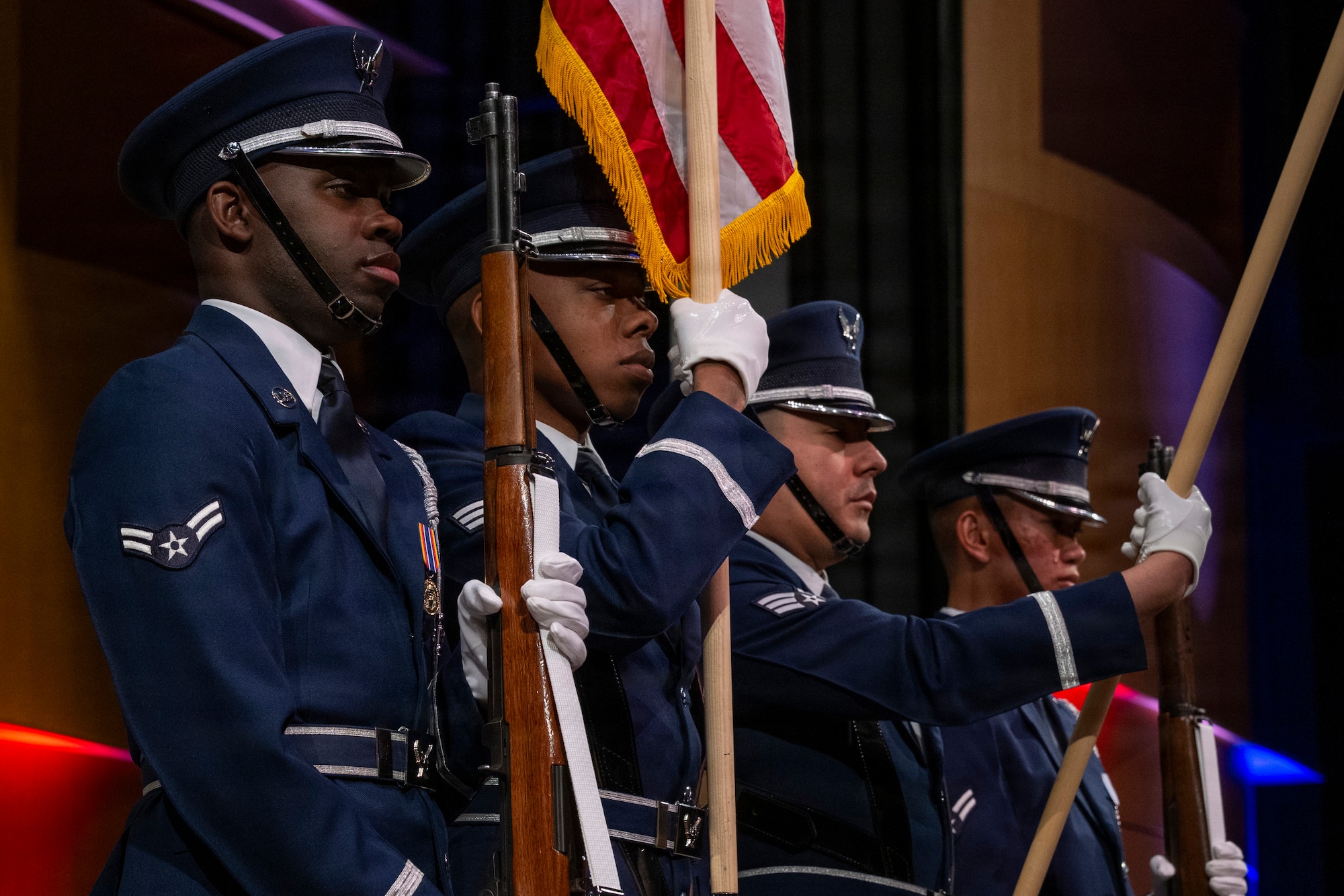 Members of the U.S. Air Force Honor Guard present the colors during a Jazz Heritage Series concert in Alexandria, Va., March 12, 2026. The Honor Guard performed ceremonial honors as part of the long-standing tradition of formally paying respect to the country and fostering unity at the start of an event. (U.S. Air Force photo by Hayden Hallman)