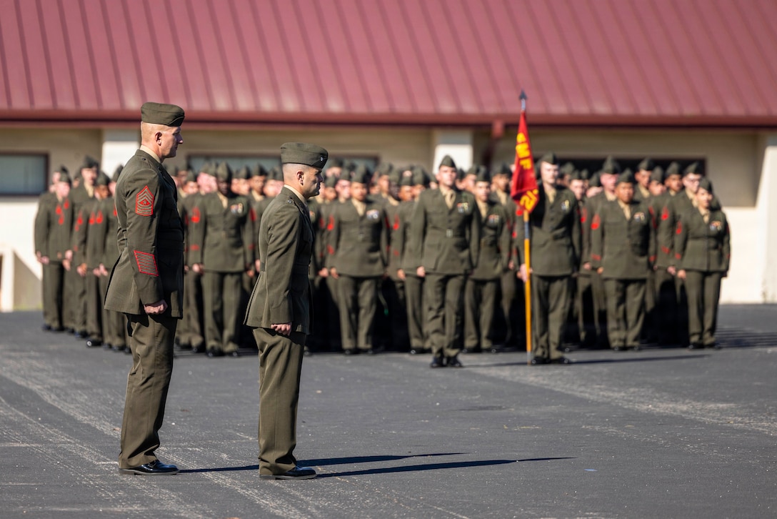 U.S Marine Corps Lt. Col. Matt Perry, the commanding officer of 2nd Battalion, 4th Marine Regiment, 1st Marine Division, I Marine Expeditionary Force and Sgt. Maj. James Young, the command senior enlisted advisor of 2/4, 1st MARDIV, stand at attention during the Battalion Landing Team 2/4 composite ceremony at Marine Corps Base Camp Pendleton, California, March 12, 2026. The ceremony was held to recognize the battalion’s transition to a battalion landing team and subsequent composite under the 13th Marine Expeditionary Unit, I Marine Expeditionary Force.  (U.S. Marine Corps photo by Cpl. Mary R. Jenni)