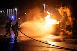 Firefighters from the 18th Civil Engineer Squadron extinguish a simulated aircraft fire during exercise Beverly Midnight 26 at Kadena Air Base, Japan, March 12, 2026. The exercise enhances interoperability by refining shared tactics, techniques and procedures among U.S. and allied forces supporting regional security. (U.S. Air Force photo by Airman 1st Class Nathaniel Jackson)