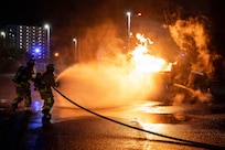 Airmen fighting fire