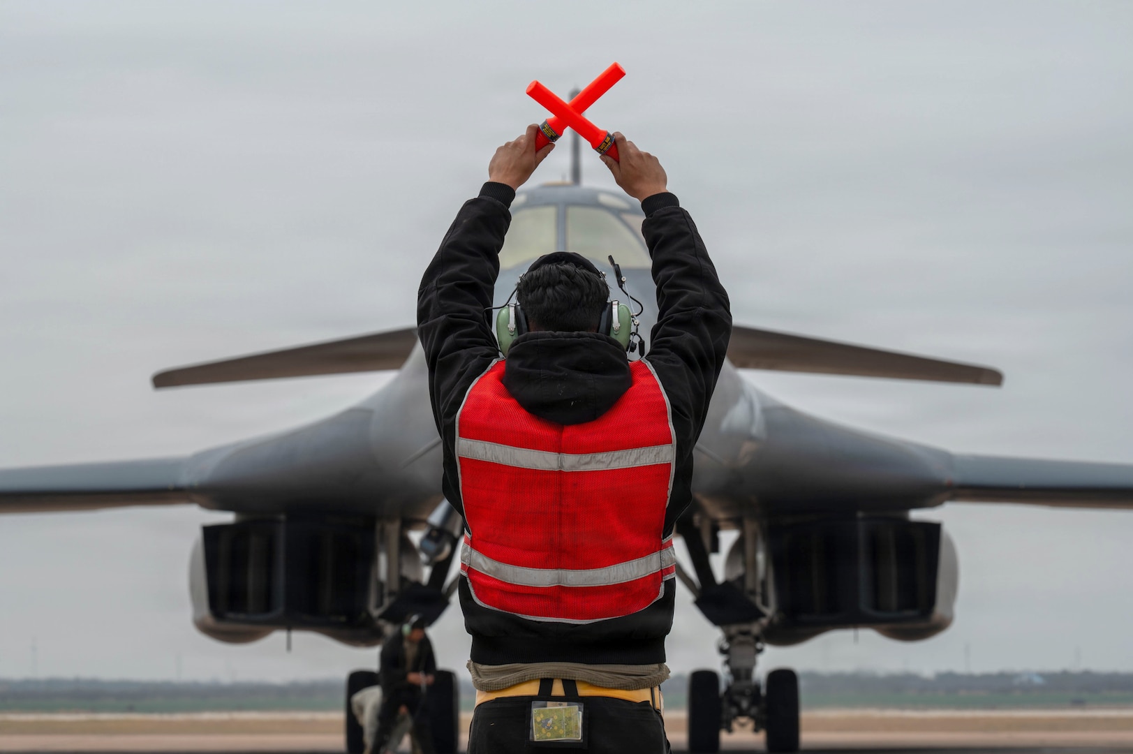 Airman marshaling B-1B