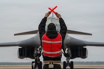 Airman marshaling B-1B