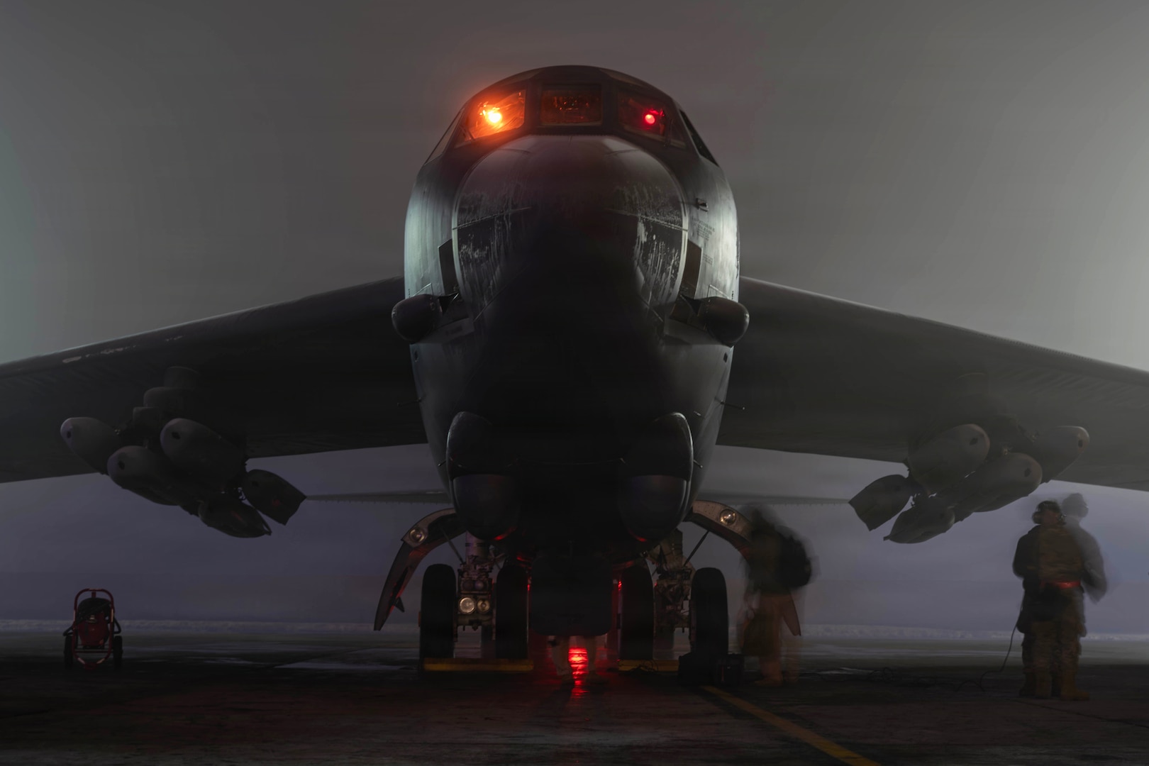 B-52 with Airmen on flightline