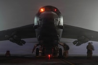 B-52 with Airmen on flightline